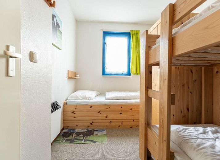 Bright living space in Bornrif vacation apartment, Hollum, Ameland with modern furnishings.