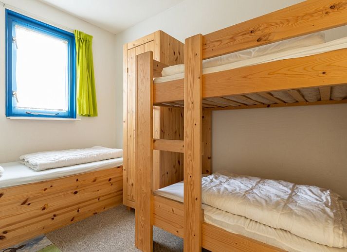 Bright living space in Bornrif vacation apartment, Hollum, Ameland with modern furnishings.