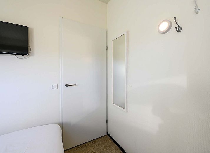 Gezellig zitgedeelte op het terras van de Vrijstaande woning in Hollum, Ameland, ideaal voor ontspanning.