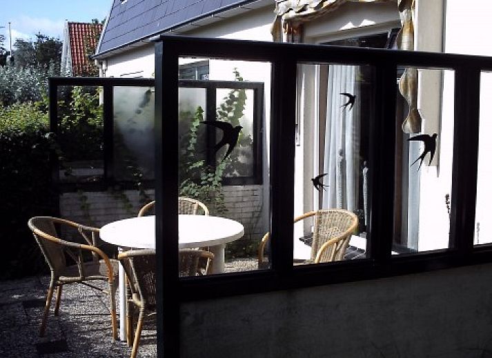 Gemtliches Wohnzimmer des Ferienhauses Schier in Schiermonnikoog, Watteninseln, mit bequemer Sitzecke.