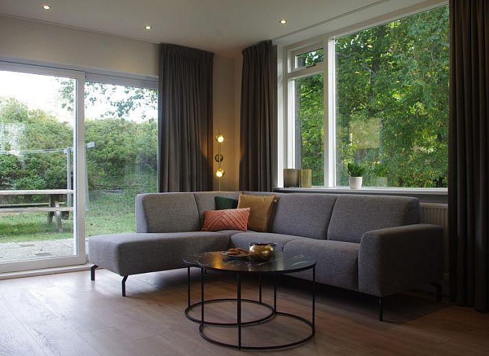 Louwtjesduin Oost vacation home in Schiermonnikoog with spacious garden and swing, ideal for families on the Wadden Islands.