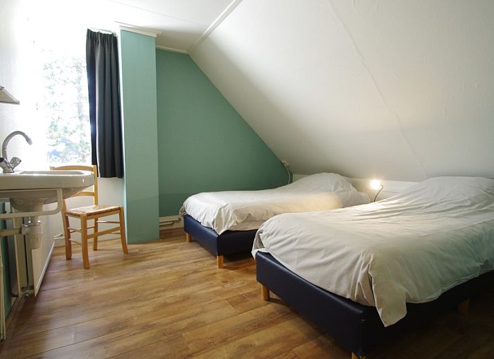 Shady garden at Louwtjesduin East vacation home in Schiermonnikoog, perfect place to relax on the Wadden Islands.