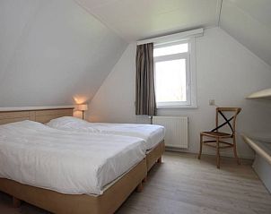 Tweede slaapkamer in 6 Persoons gezellige vakantiebungalow De Cocksdorp Texel, ideaal voor familie.