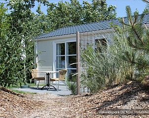 Relax on the terrace of Luxury 2 person Hotel Chalet on Texel, in the middle of nature of De Cocksdorp.