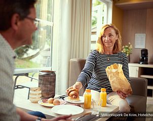 Enjoy a delicious breakfast in Luxury 2 person Hotel Chalet, De Cocksdorp, Texel, with fresh orange juice and croissants.