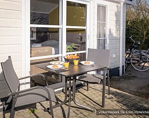 Breakfast on the terrace of Luxury 2 person Hotel Chalet in De Cocksdorp, Texel, overlooking the peaceful surroundings.