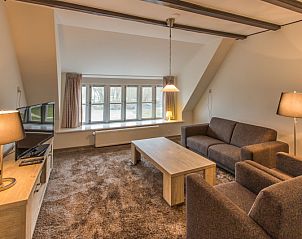 Gemtliches Wohnzimmer im Typ X-7 Ferienhaus De Cocksdorp Texel mit bequemen Sofas