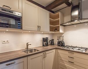 Modern kitchen in Type T-3 vacation home, De Cocksdorp, Texel, with built-in appliances.