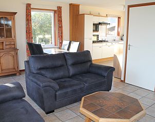 Open kitchen and dining area in Dune/lighthouse view detached vacation home, De Cocksdorp, Texel.