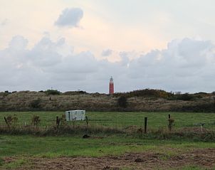 View of lighthouse from Dune/lighthouse view detached vacation home, De Cocksdorp, Texel.