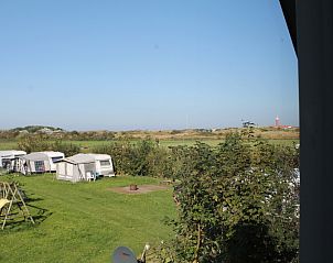 Panoramic view of nature and lighthouse at Dune/lighthouse view detached vacation home, Texel.