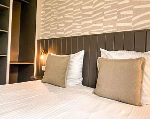 Cozy bedroom with night lights in Holiday home Hogezandskil, De Cocksdorp, Texel for a relaxing stay.