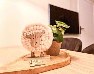 Detail of decoration in Holiday home Hogezandskil, De Cocksdorp, Texel with cute sheep and green plant.