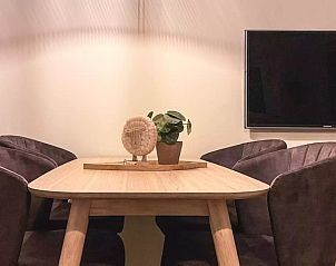 Dining table with decorative elements in Holiday home Hogezandskil, De Cocksdorp, Texel for atmospheric dinners.