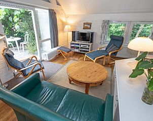 Cozy living room of Holiday home Slufterduin 108 in De Cocksdorp Texel, perfect for relaxation on the Wadden Islands.