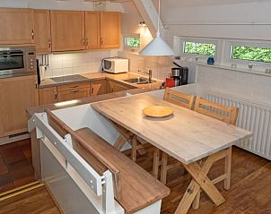 Functional kitchen and dining area in Holiday home Slufterduin 108, De Cocksdorp Texel, for a comfortable vacation.