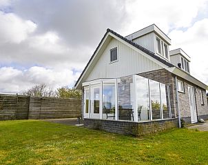 Plexat vacation home in De Cocksdorp, Texel with spacious garden and glass veranda