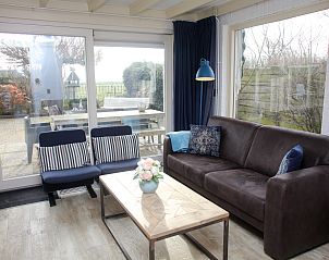 Sitzecke mit Aussicht im Ferienhaus Blom & Co, De Cocksdorp, Texel.