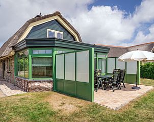 Villa De Witte Hoek Wintergarten in De Cocksdorp, Texel mit sonniger Terrasse und modernem Auenbereich.