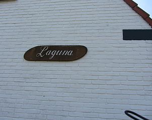 Unique sign on the wall of De Vlinder, vacation home in De Cocksdorp, Texel, with the name 'Laguna'.