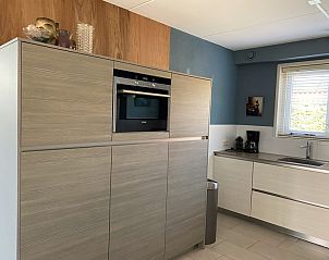 Bedroom with balcony in Frederik and Lodevika vacation home, De Cocksdorp, Texel.