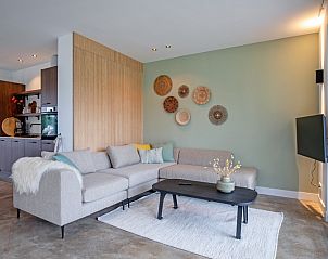 Moderne Sitzecke im Ferienhaus Griend, De Cocksdorp, Texel mit Blick auf die Terrasse.