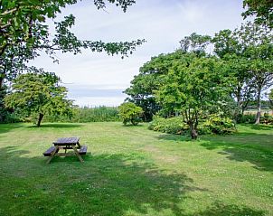Gemtliche Terrasse in Paal 91 Texel, Ferienhaus in De Cocksdorp, mit Sitzgelegenheit.