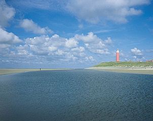 Beautiful view of the lighthouse from Type 1 - 2100 vacation home, De Cocksdorp, Texel, surrounded by nature.