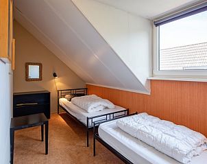 Cozy attic room with two beds in Holiday home Slufterhoek 132, Texel, ideal for children