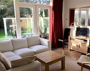 Bright living room in Holiday home Slufteroord 270, De Cocksdorp Texel, with access to the terrace and modern amenities.