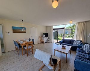 Modern interior of Bungalow 178 at Bungalowpark Tamarisk Texel, De Cocksdorp, with cozy sitting area.