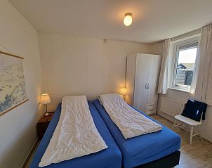 Comfortable bedroom in Bungalow 178 at Bungalowpark Tamarisk Texel, De Cocksdorp, with two single beds.