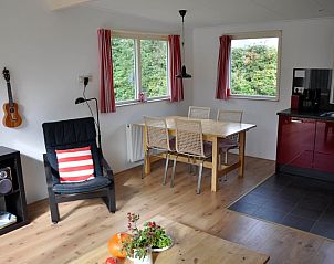 Dining area and kitchen in Holiday home Slufteroord 312, Bungalowpark Slufteroord, De Cocksdorp, Texel.
