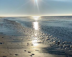 Sonnenuntergang am Strand in der Nhe des Ferienhauses in De Cocksdorp, Texel, mit herrlichem Blick auf die Watteninseln.