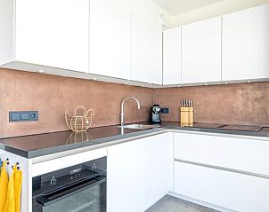 Luxurise Kche in einem Ferienhaus in De Cocksdorp, Texel, mit eleganter Verarbeitung und modernen Annehmlichkeiten auf den Watteninseln.