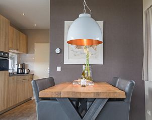 Modern kitchen and dining area in Chalet 27 Newbay, De Cocksdorp Texel.