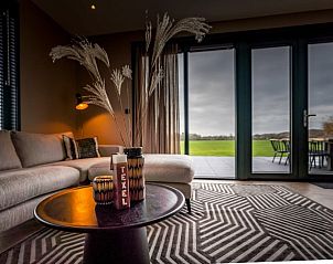 Sitzecke mit Blick auf den Garten im Ferienhaus fr 6 Personen in De Cocksdorp, Texel.