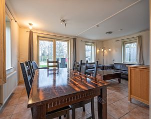 Dining room by Tongelen R.D. van, vacation home in De Cocksdorp, Texel. Spacious table overlooking the garden.