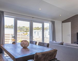 Dining area in Chalet Bregkoog 231, De Koog, Texel overlooking the terrace on Chaletpark Bregkoog.