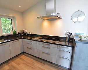 Modern kitchen of Orchismient 49 vacation home in De Koog, Texel with clean lines and high-quality appliances.