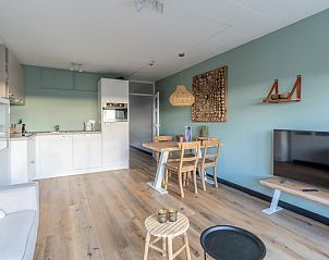 Offene Kche und Essbereich im Apartment Juliana 140 Insel- und Meerblick, De Koog, Texel fr ein gemtliches Abendessen.