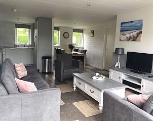 Cozy living room with sitting area in Bungalow 23, De Koog, Texel, Wadden Islands.