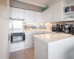 Fully equipped kitchen in Apartment Juliana 160 Zeezicht, a vacation accommodation in De Koog, Texel, with modern appliances.