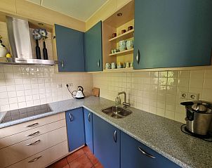 Fully equipped kitchen in Residence California - Geborchenheit - 361, vacation home on Texel, with blue cabinets.