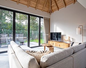 Seating area of Villa Flo, De Koog, Texel overlooking the terrace and garden.