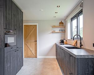 Modern kitchen of Villa Flo, vacation home in De Koog, Texel with luxury appliances.