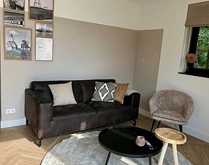 Gemtliches Wohnzimmer im Ferienhaus Noordwester, De Koog Texel mit komfortabler Sitzecke