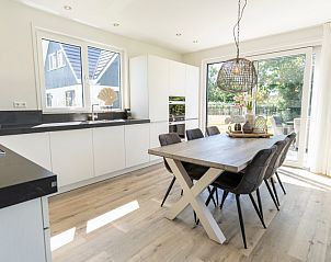 Spacious kitchen in Villa 35a, De Koog, Texel overlooking the garden.