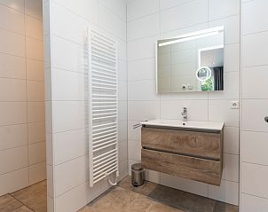 Modern bathroom in Villa 35a, De Koog, Texel with stylish sink.