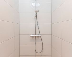 Walk-in shower in Villa 35a, De Koog, Texel with sleek design.